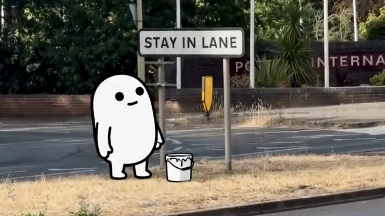 What is a changemaker: an illustrated part beside a Stay In Lane road sign with a bucket of paint